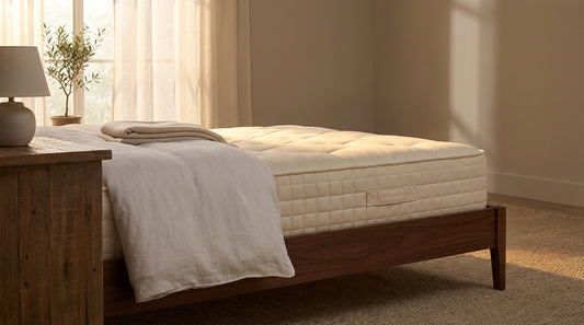 A what goes under a mattress in a beautifully styled bedroom
