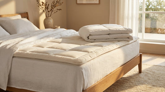 A mattress pad in a beautifully styled bedroom